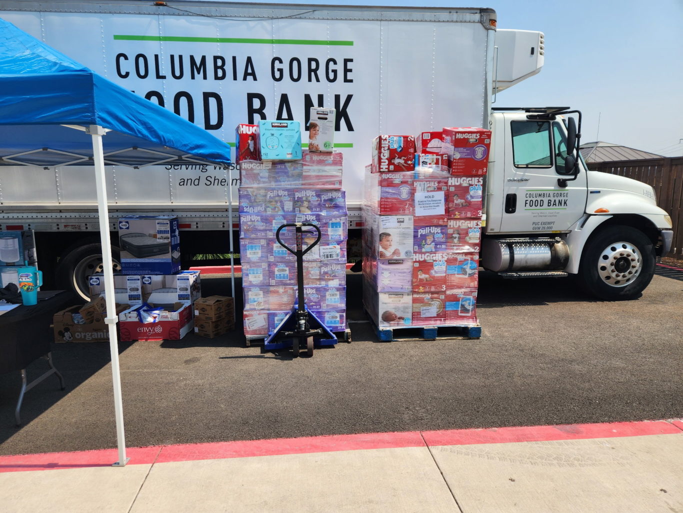 Columbia Gorge Truck two stacks of diapers to support Rowena Fire community members
